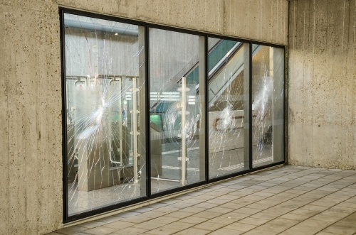 security-film-protected-glass-windows-with-impact-marks